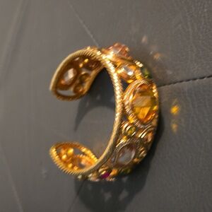 Gold bracelet with stones